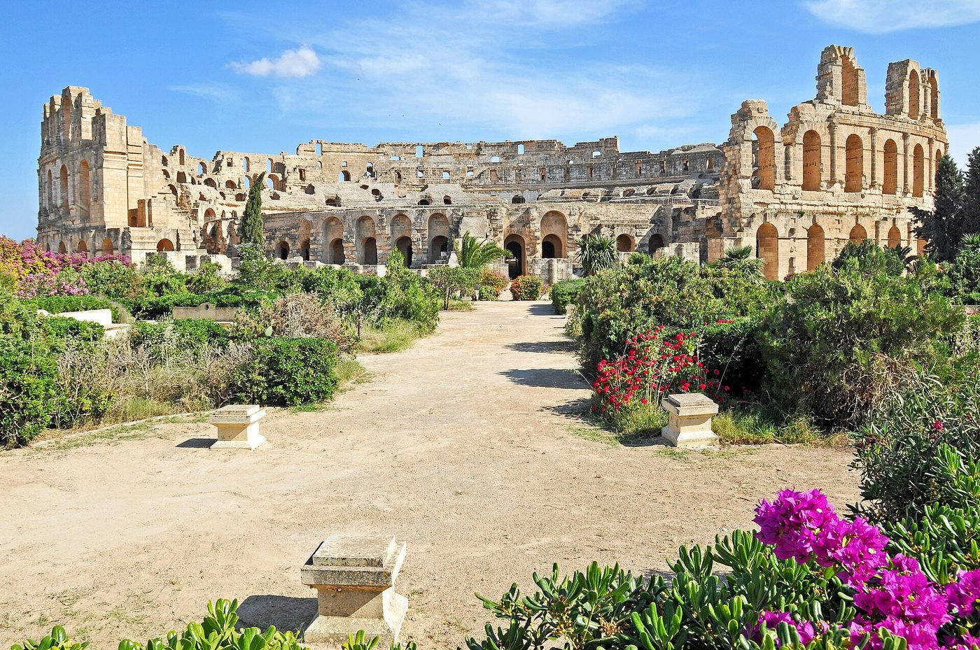 The vast Roman amphitheatre of El Djem rising above the town, Tunisia.