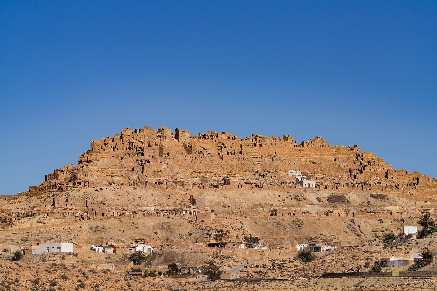 The Berber village of Chenini built into a mountainside, a day trip from Djerba to the ksour country