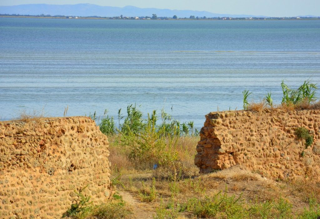 Old stone fortifications overlooking the wide lagoon at Ghar el Melh on Tunisia's north coast