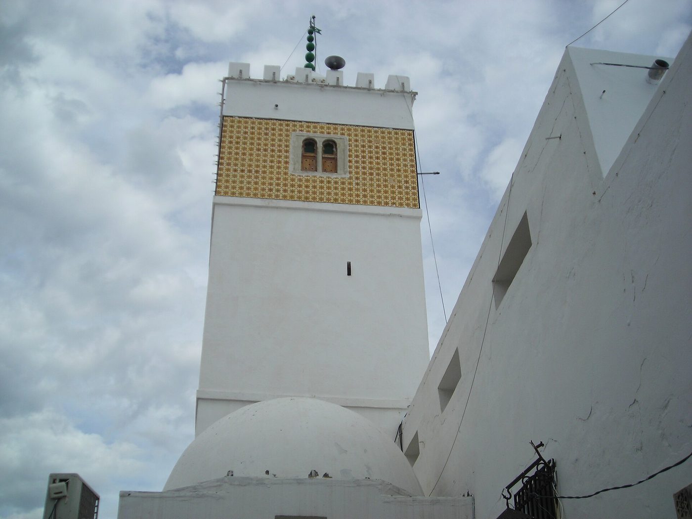 The minaret of Hammamet's 15th-century Great Mosque rising over the whitewashed rooftops of the medina