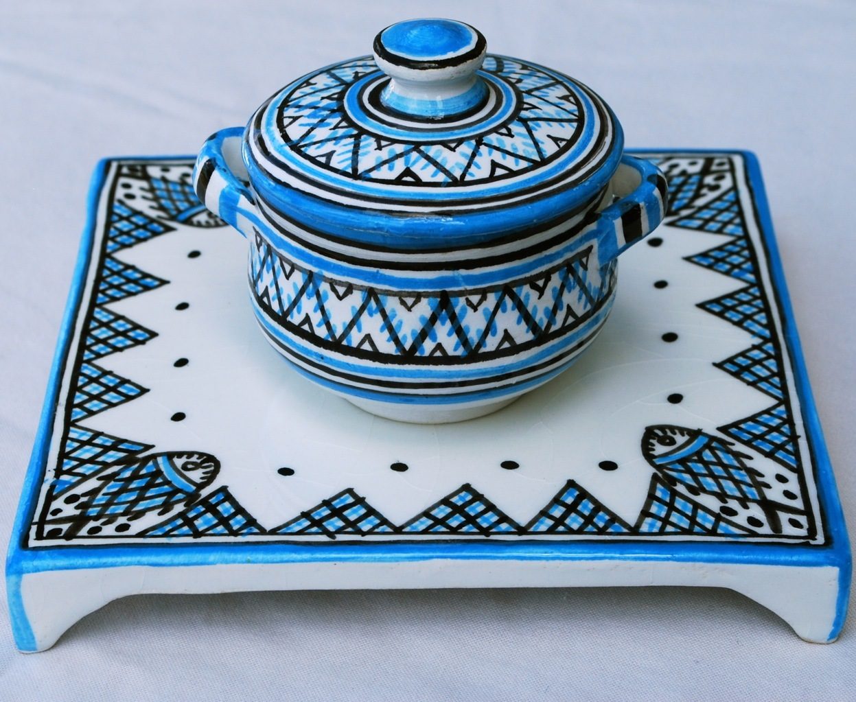 Hand-painted Nabeul pottery on display in a ceramics workshop in Nabeul, Tunisia