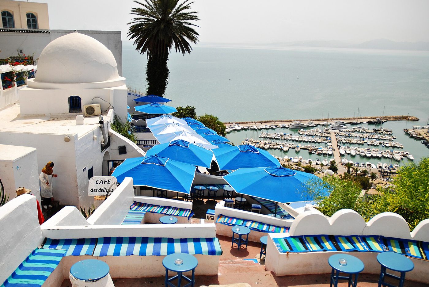 Blue parasols of a clifftop café terrace overlooking the sea at Sidi Bou Said near Tunis