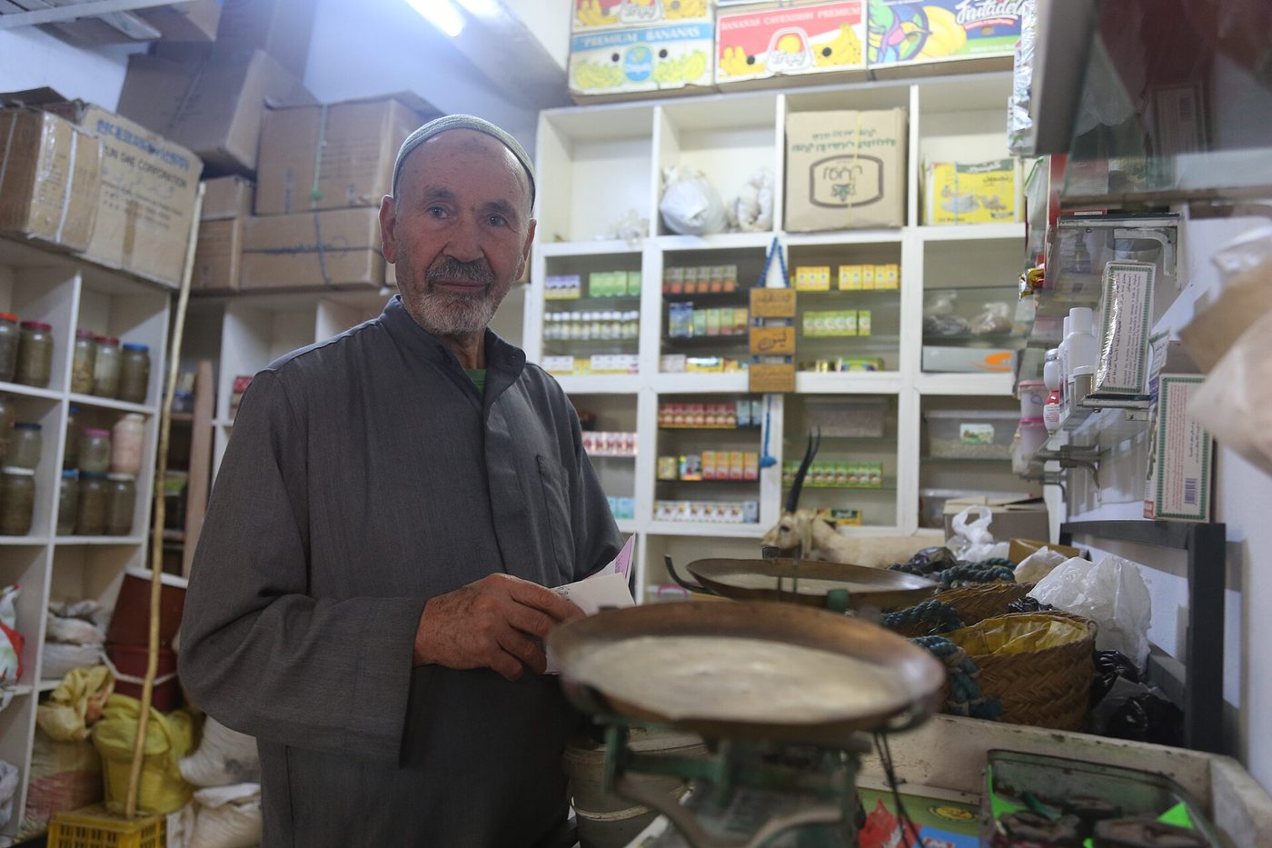 Shops in a Tunisian medina souk, where haggling is normal and the carpet-shop tea routine begins