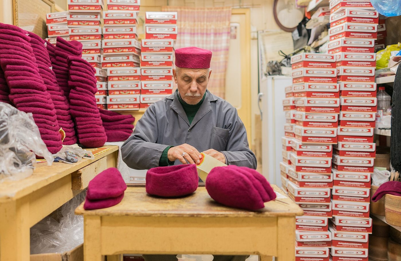 A chechia maker at work in the Tunis medina souks, the heart of a weekend in Tunisia