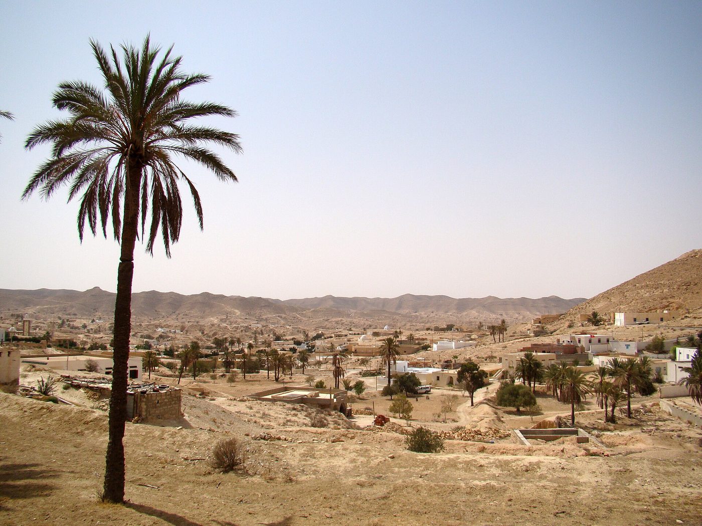 The bare hills around Matmata in southern Tunisia, pitted with the craters of underground Berber houses
