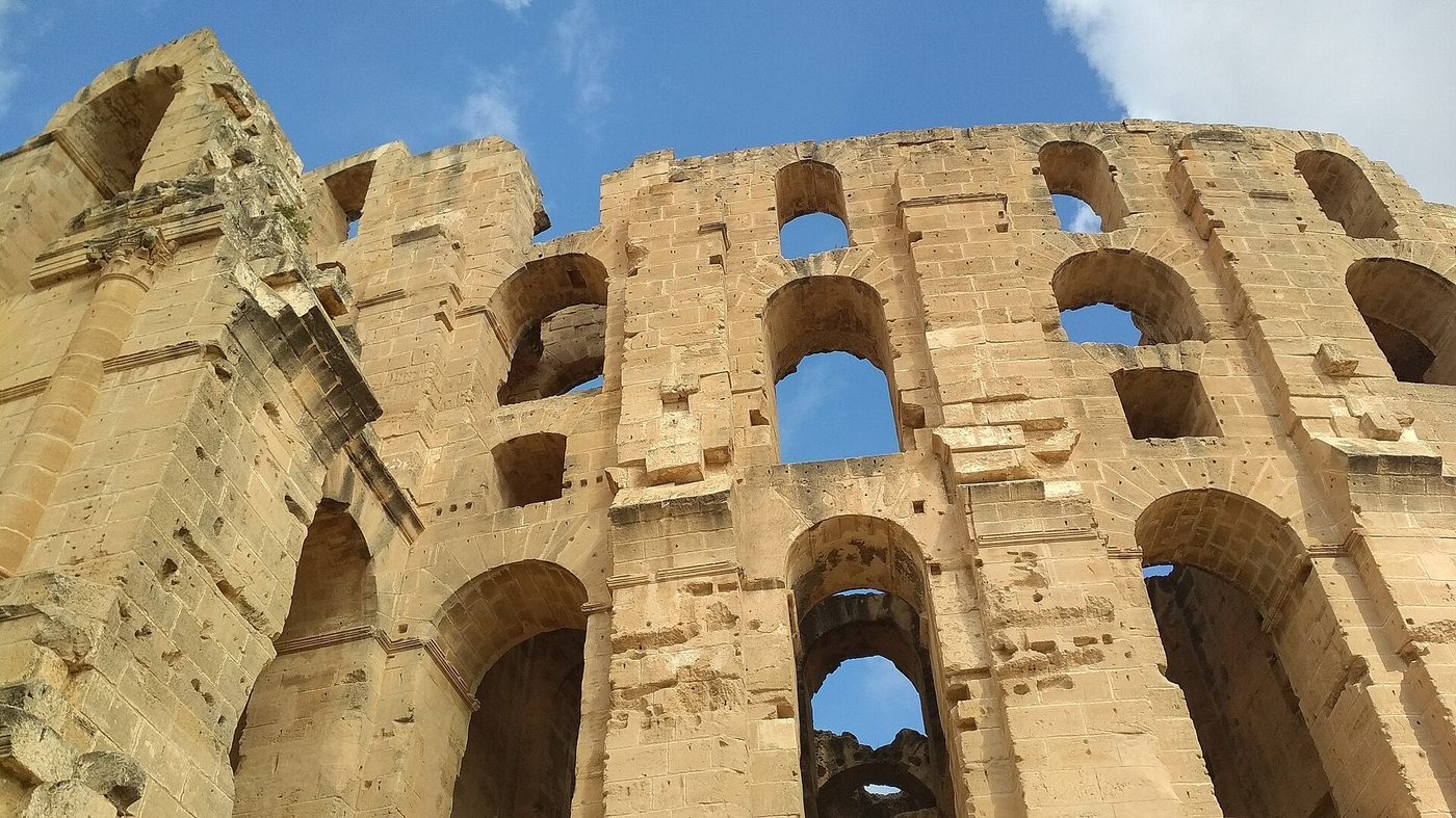 The three-tiered stone facade of the Roman amphitheatre at El Jem, Tunisia