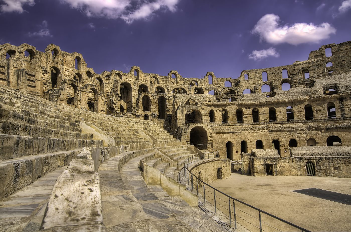 Interior view of the El Jem amphitheatre showing the arena floor and surviving seating tiers